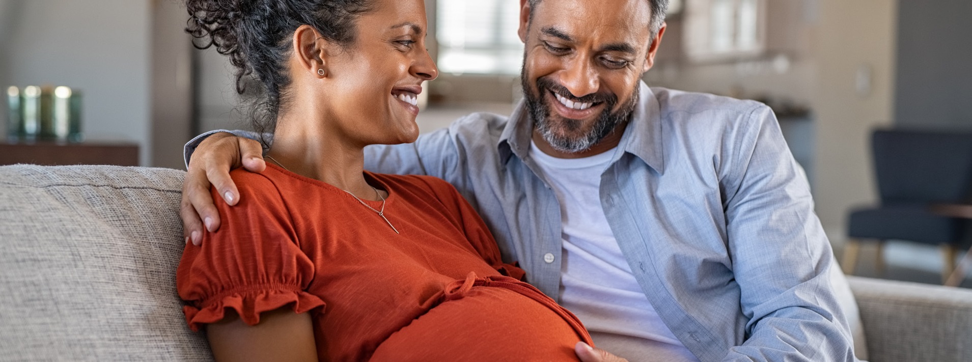 Happy mixed race couple expecting baby