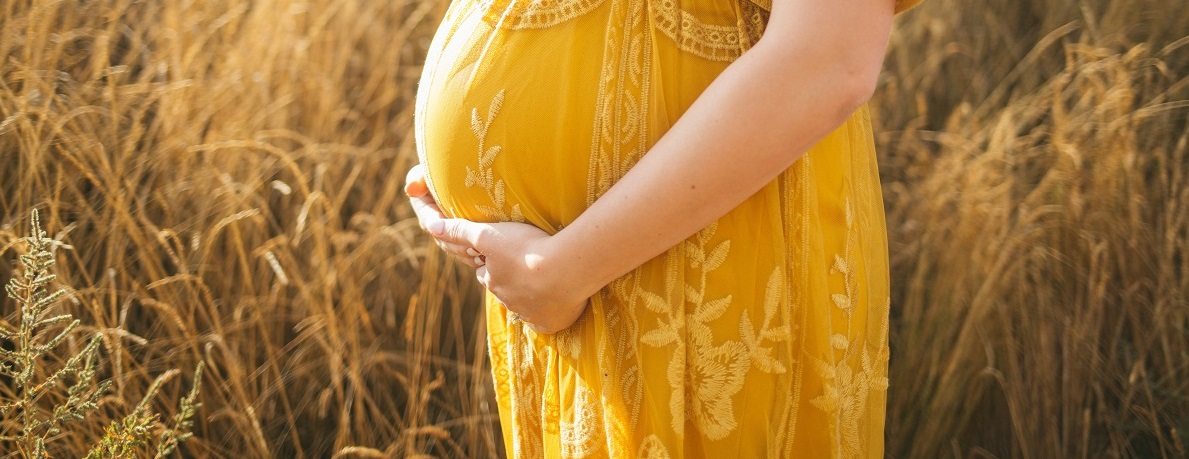 a pregnant woman outdoors