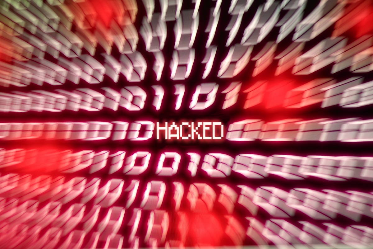 the word "hacked" in the middle of a red blurred background