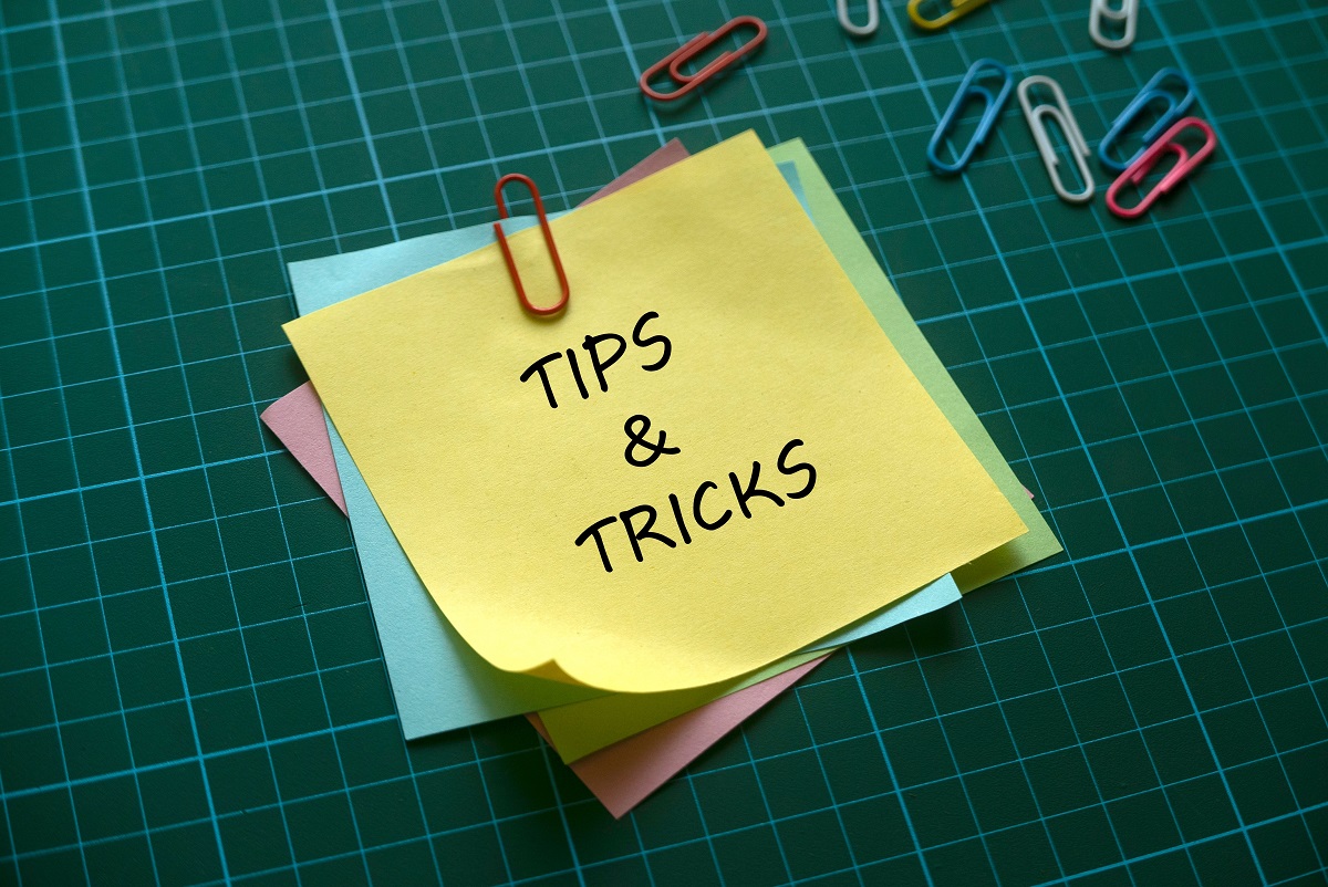 a post it note that says "tips & tricks"