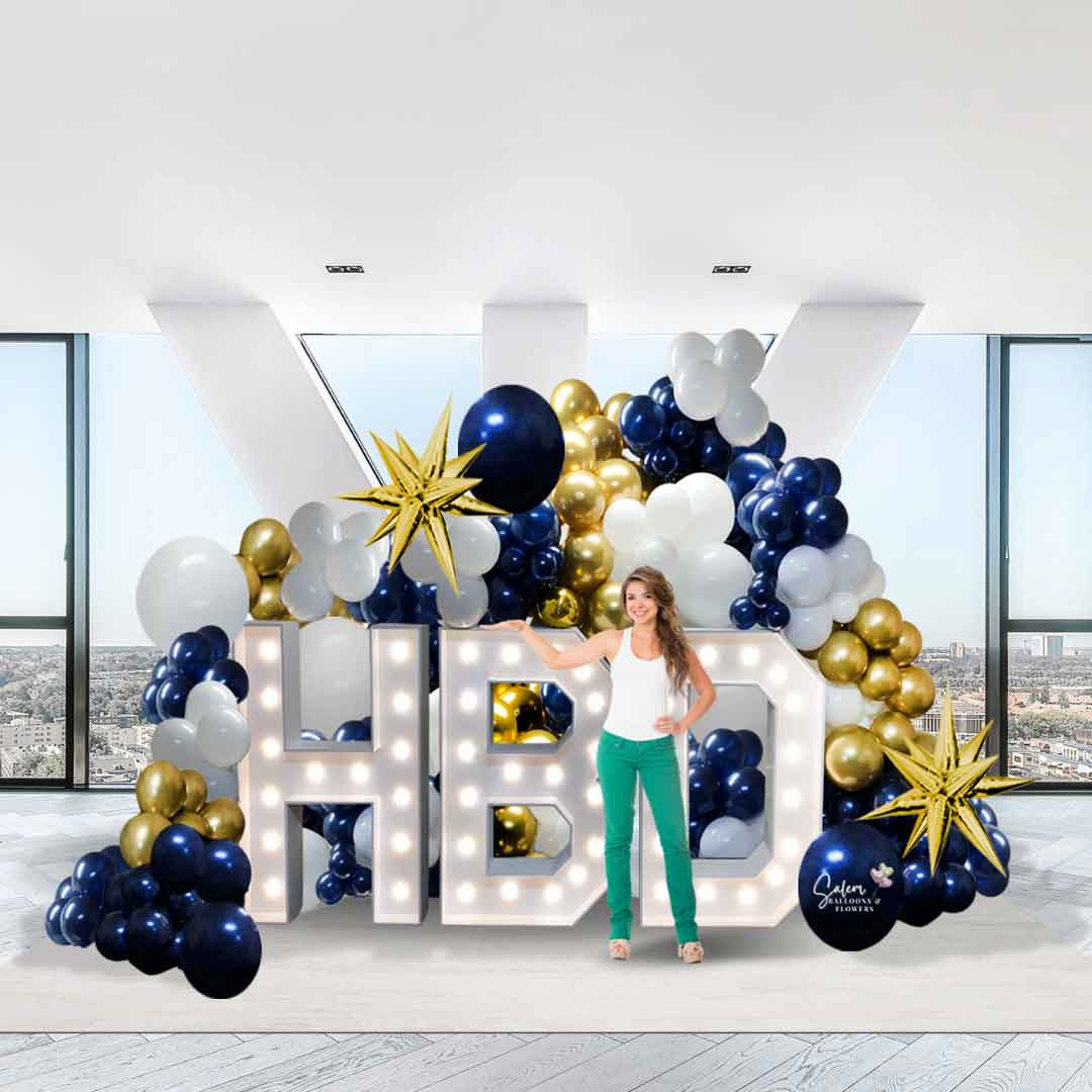 Large white HBD light-up Marquee letters surrounded by a balloon decoration.