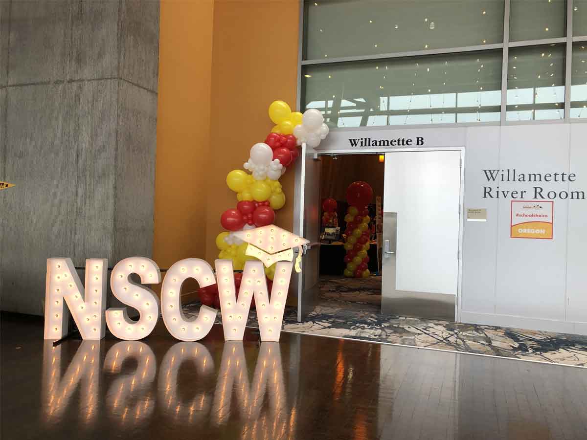 Balloon garland with light-up marquee letters.