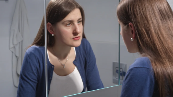 girl looking in mirror
