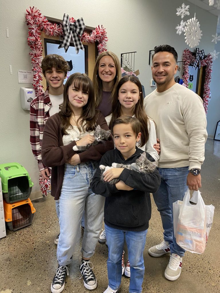 Family adopts two at friends of felines