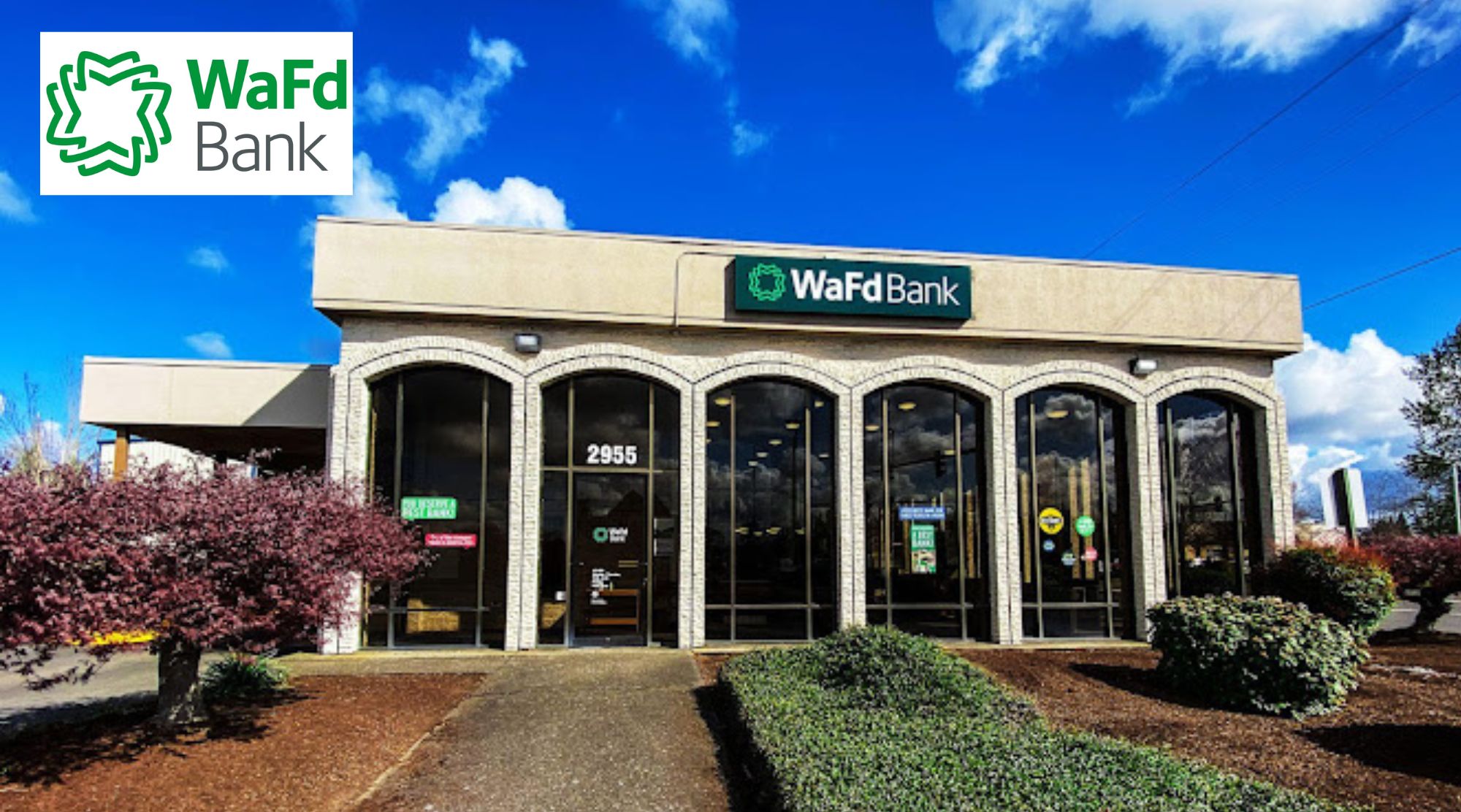 WaFd Bank North Salem, Oregon - front of bank view showing arched windows across the front and landscaping on a blue sky day