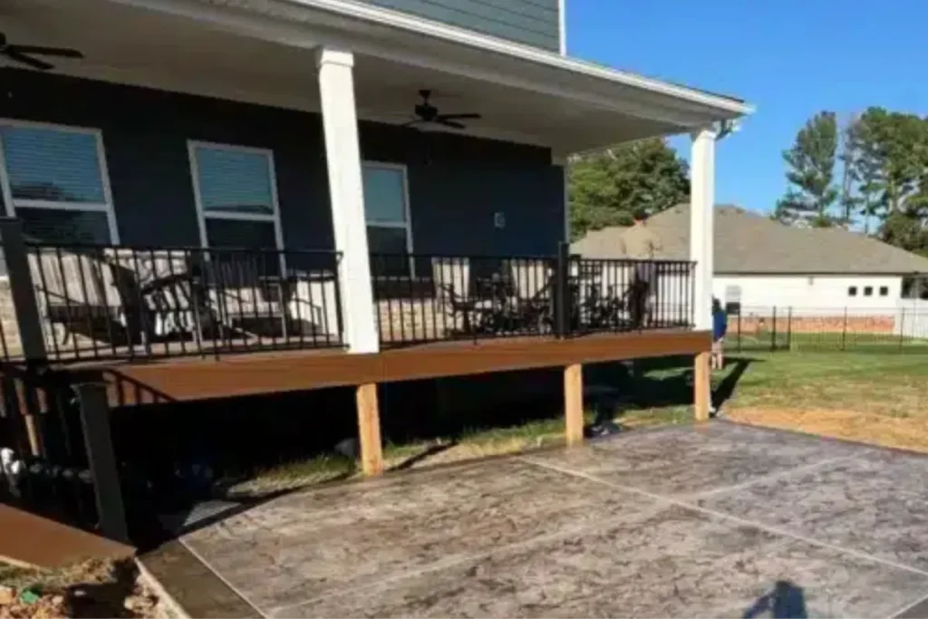 Stamped concrete patio next to a wooden deck for covered patios in La Vergne, TN.