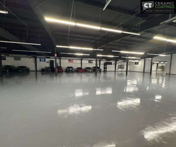 High-angle view of a large, indoor climate-controlled storage area showing reflective floors and overhead lighting.